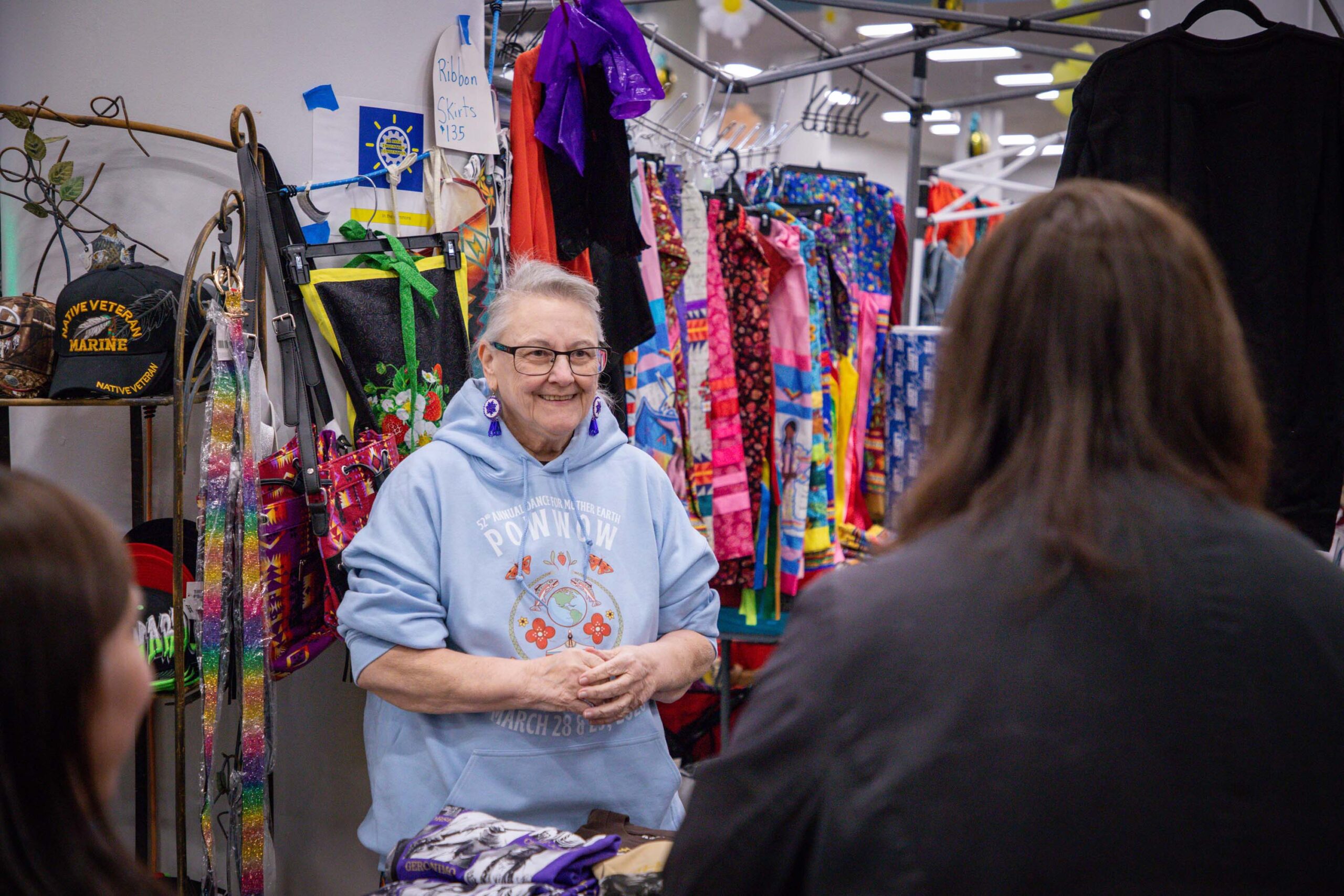 older woman standing with crafts